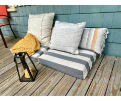 Patio cushions, pillows, lantern, blanket